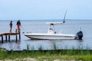 docked boat with people on dock